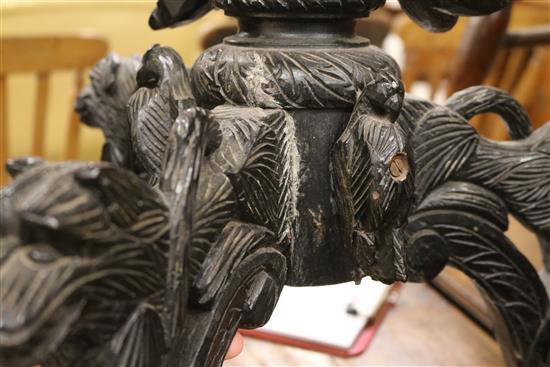 A carved tripod table W.55cm